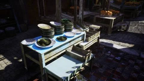 Bright market setup showcasing stacked plates and handcrafted floor patterns Stock Footage 341593058