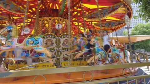 The bright merry-go-round is spinning. Stock Footage
