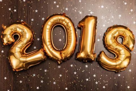 Bright metallic gold balloons figures 2018, Christmas, New Year Balloon with Fotos de archivo