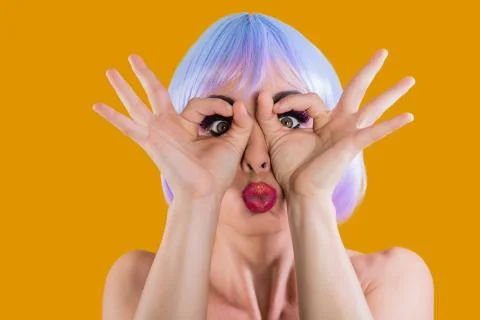 Bright model making faces at camera Stock Photos