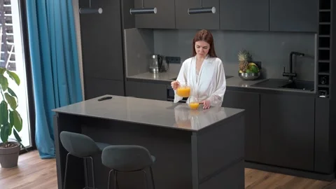 A bright, modern kitchen designed for fresh juice, perfect for a vibrant, health Stock Footage 293487616