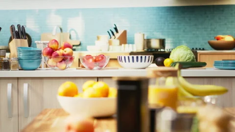 Bright modern kitchen interior with elegant furniture and wooden cupboards Stock Footage 321314776