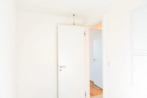 Bright modern technical room with open white doors, housing home utility systems Stock Photos