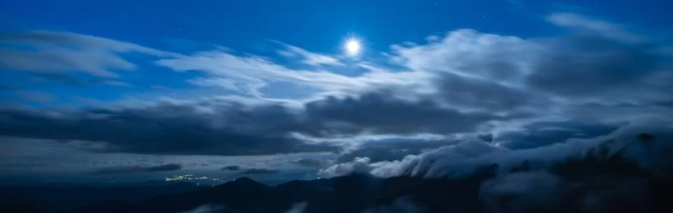 The bright moon on the cloud background Stock Photos