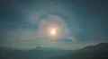 The bright moon with halo effect on the background of beautiful mountain Photo