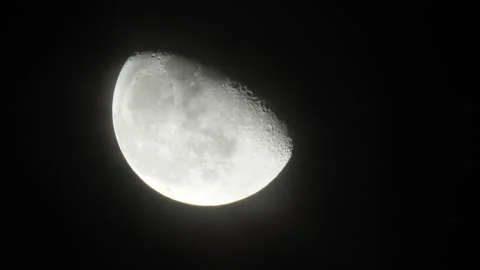 Bright moon move across night sky, light clouds fly over, time lapse shot Stock Footage 155599077