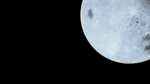 Bright moon in the night sky over a dark background Stock Footage 344112334