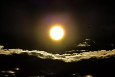 Bright moon over clouds at night Fotos Stock