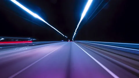 Bright Motion Hyperlapse of a Speedy Night Drive in a Big City, Windshield View Stock Footage 229615436
