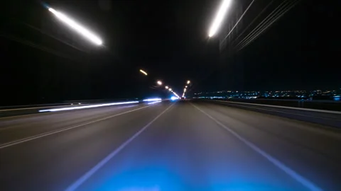 Bright Motion Timelapse of a Speedy Night Drive in a Big City, Windshield View Stock Footage 328337156