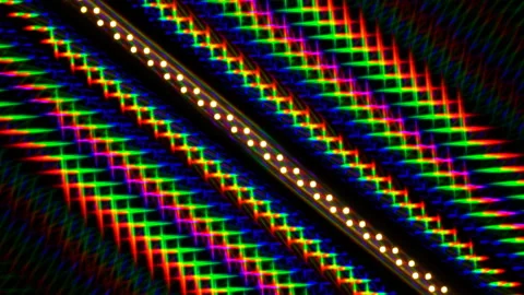 Bright multi-color image of light diffraction from a rotating line of LEDs Stock Footage 130383899