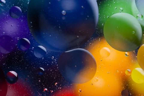 Bright multi colored background, circles in water Stock Photos