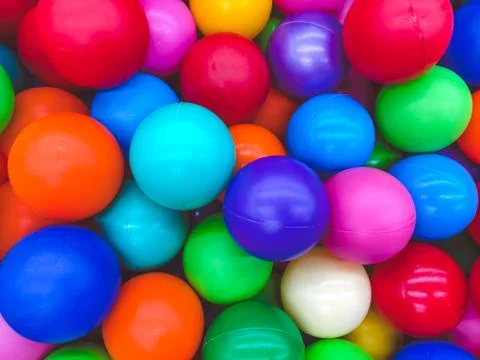 Bright multi-colored balls for the pool for childrens games. Stock Photos