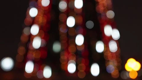 Bright multi-colored lights on the New Year's tree move at different speeds. Stock Footage 218310840