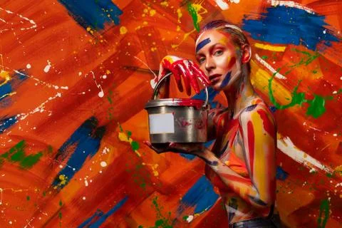 Bright multi-colored paint on the body of a young beautiful woman. Carnival Stock-Fotos