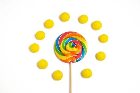 Bright multi-colored round lollipop. Isolated on a white background. There are Stock Photos