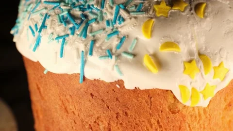 Bright multi-colored sprinkles on an Easter cake Stock Footage 191029522