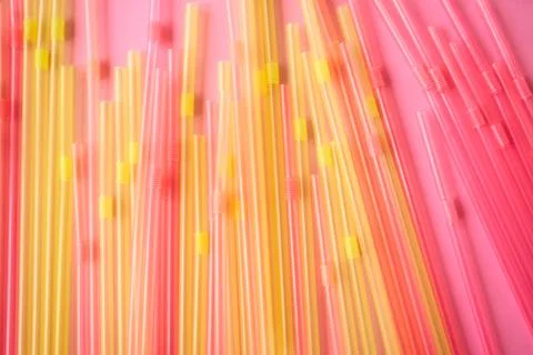 Bright multicolor background made with plastic straws. Stock Photos