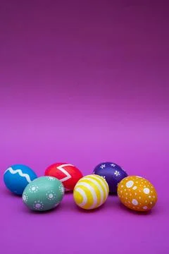 Bright Multicolor Eggs With Patterns On Pink Background Stock Photos