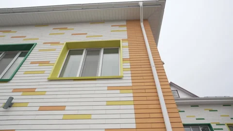 Bright multicolored facade with striped paneling and windows Stock Footage 309785129