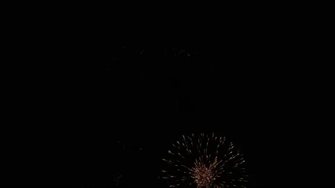 Bright multicolored flashes of fireworks in the night sky on a black background. 스톡 동영상 117794296