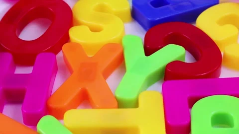 Bright multicolored letters rotating as a background close up Stock Footage 236143883