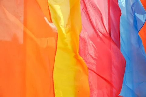 Bright multicolored vertical flags on flagpoles Stock Photos