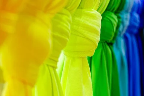 Bright multicoloured folded textile sheets Stock Photos
