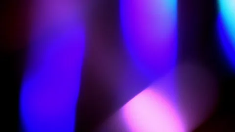 Bright neon light rays of rainbow colors move chaotically on a black background Stock Footage 269263760