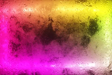 A bright neon rectangle flashes through a foggy window. Drop of water on the  Stock Photos