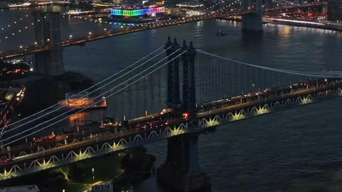 Bright night view of Manhattan Bridge over water in New York City Stock Footage 321360355