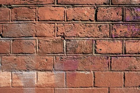 Bright old red brick wall. rough surface texture Stock Photos