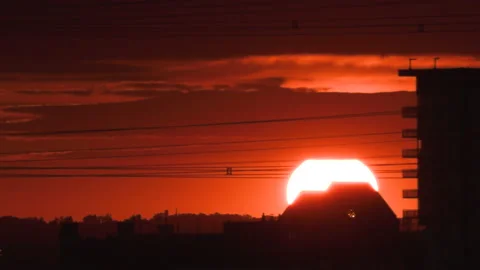 Bright orange and red sunset over the lake by the beach on hot summer evening Stock Footage 156707038