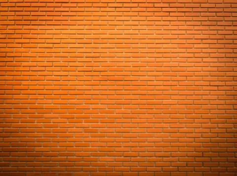 Bright orange brick wall texture for background Stock Photos