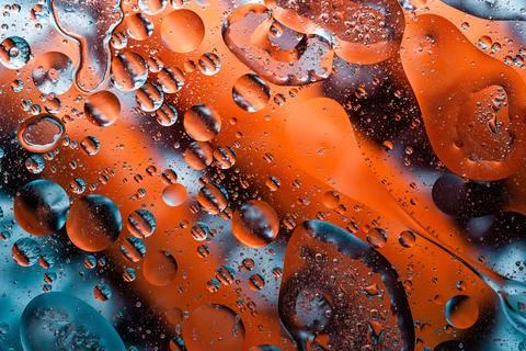 Bright orange bubble fluid macro background photo Stock Photos
