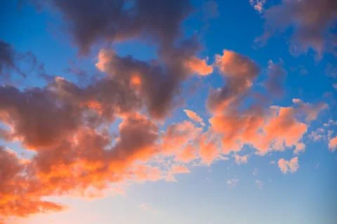 Bright orange clouds in the evening sky Stock Illustration