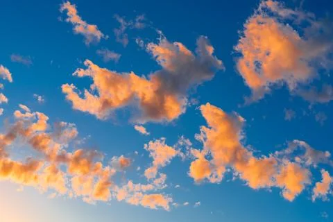 Bright orange clouds in the evening sky Stock Photos