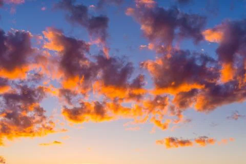 Bright orange clouds in the evening sky Stock Photos