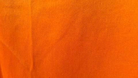 Bright orange fabric texture with fine woven threads and patterns Stock Photos