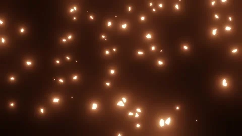 Bright orange fire ember sparks falling vertically through a pitch black va.. Video stock 330032823