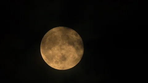 Bright Orange Full Moon Behind Misty Clouds Close Up, 4k Stock Footage 100991085