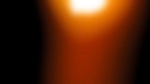 Bright orange light flare on a solid black background, abstract overlay Stock Photos