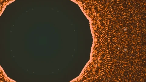 Bright orange particles occupied the whole space except of a round part with Stock Footage 123091053