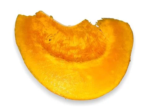 Bright orange pumpkin slice with bite mark Stock Photos