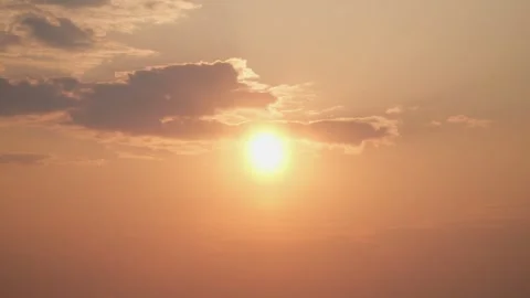 Bright orange sun and clouds. Dramatic sunset in the sky. Stock Footage 242285015