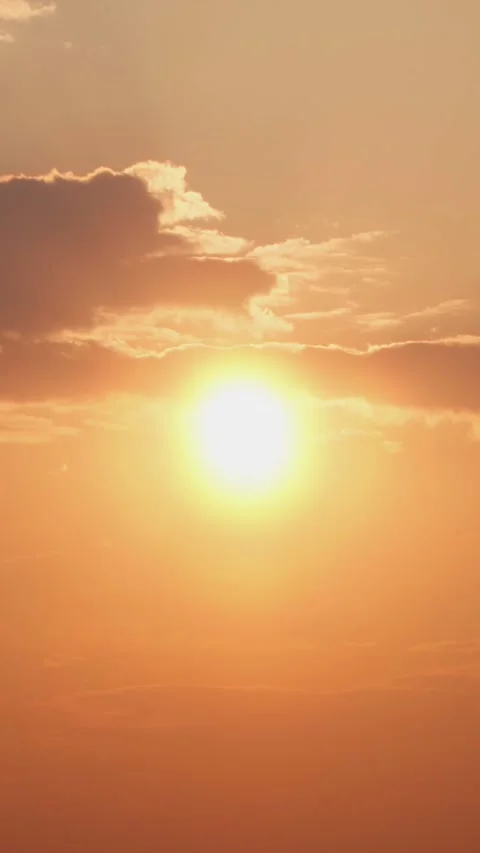 Bright orange sun and clouds. Spectacular sunset in the sky. Stock Footage 293138120