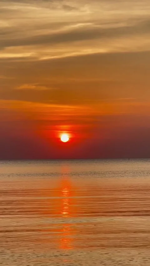 Bright Orange Sunset Over Calm Ocean Horizon Video stock 341267458