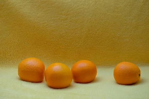 Bright orange on yellow background Stock Photos