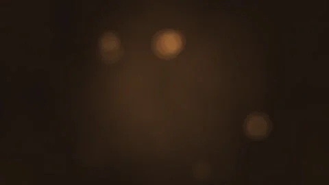 Bright orbs floating in dark space with warm glow effects Stock Footage 338227707