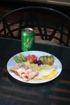 Bright outdoor breakfast table featuring sunny side up eggs Stock Photos